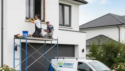 Professional wood rot repair and exterior painting on Tulsa, OK home siding by expert painters